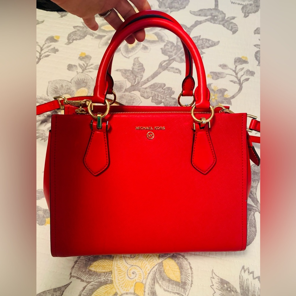 Never uses gorgeous red Michael Kors purse